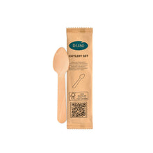 A 1/1 coffee spoon 110 mm made of wood from Duni GmbH lies next to an individually wrapped, natural paper sleeve with recycling symbol and sustainability information on a white background. The package contains 250 pieces.