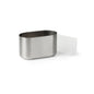 The Duni GmbH cutlery and napkin holder oval Pond, an oval tabletop holder made of stainless steel with an open top and a white rectangular side attachment, is depicted against a simple white background.