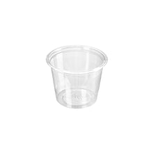 The Duni GmbH dressing cup 30 ml, rPET 45x45x33 appears empty against a white background. The transparent cup is ideal as a sustainable disposable cup for sauces or dressings thanks to its simple, cylindrical shape. Package: 100 pieces.