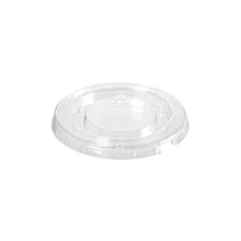 The rPET lid dressing cup 30 / 60 ml from Duni GmbH is a clear, round, transparent lid with a raised center and an embossed recycling symbol, highlighting its environmentally friendly design. It is depicted on a white background. Package: 150 pieces.
