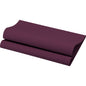A folded, textured yoga mat in dark violet is presented against a white background, reflecting the rich color tones of the Bio-Dunisoft napkins 40 x 40 cm 1/4 fold from Duni GmbH and their environmentally friendly, elegant tableware design.