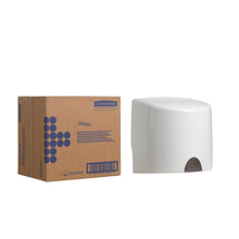 A box labeled "Kimberly-Clark GmbH" stands next to a white Aquarius™ towel dispenser - central dispensing, ideal for hygienic towel removal, on a plain white background.