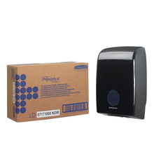 A brown box labeled "Kimberly-Clark GmbH" and a black Aquarius™ dispenser for folded towels - Interfold are depicted side by side against a white background.