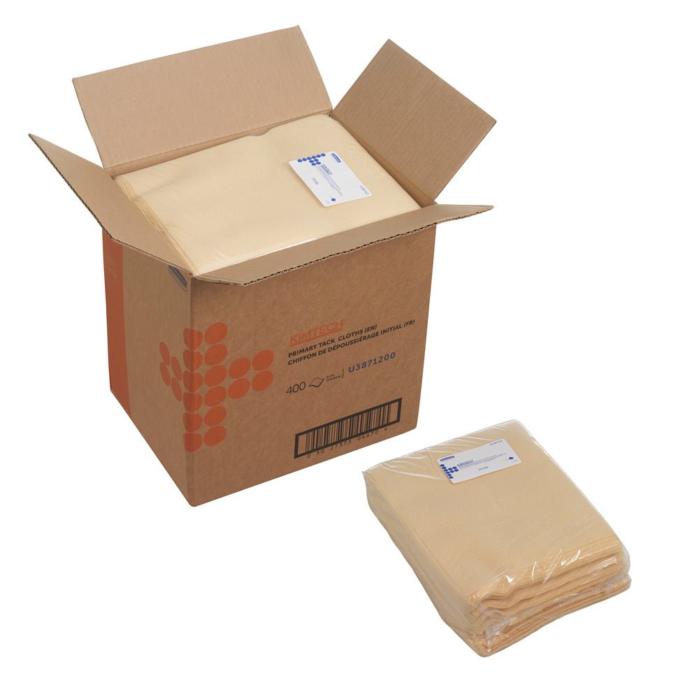 A brown "Kimtech®" box from Kimberly-Clark GmbH with a white and blue label contains four bags of Auto Primary Tack Wipes, flat cloth, white; a sealed stack with 100 sheets lies outside the box.