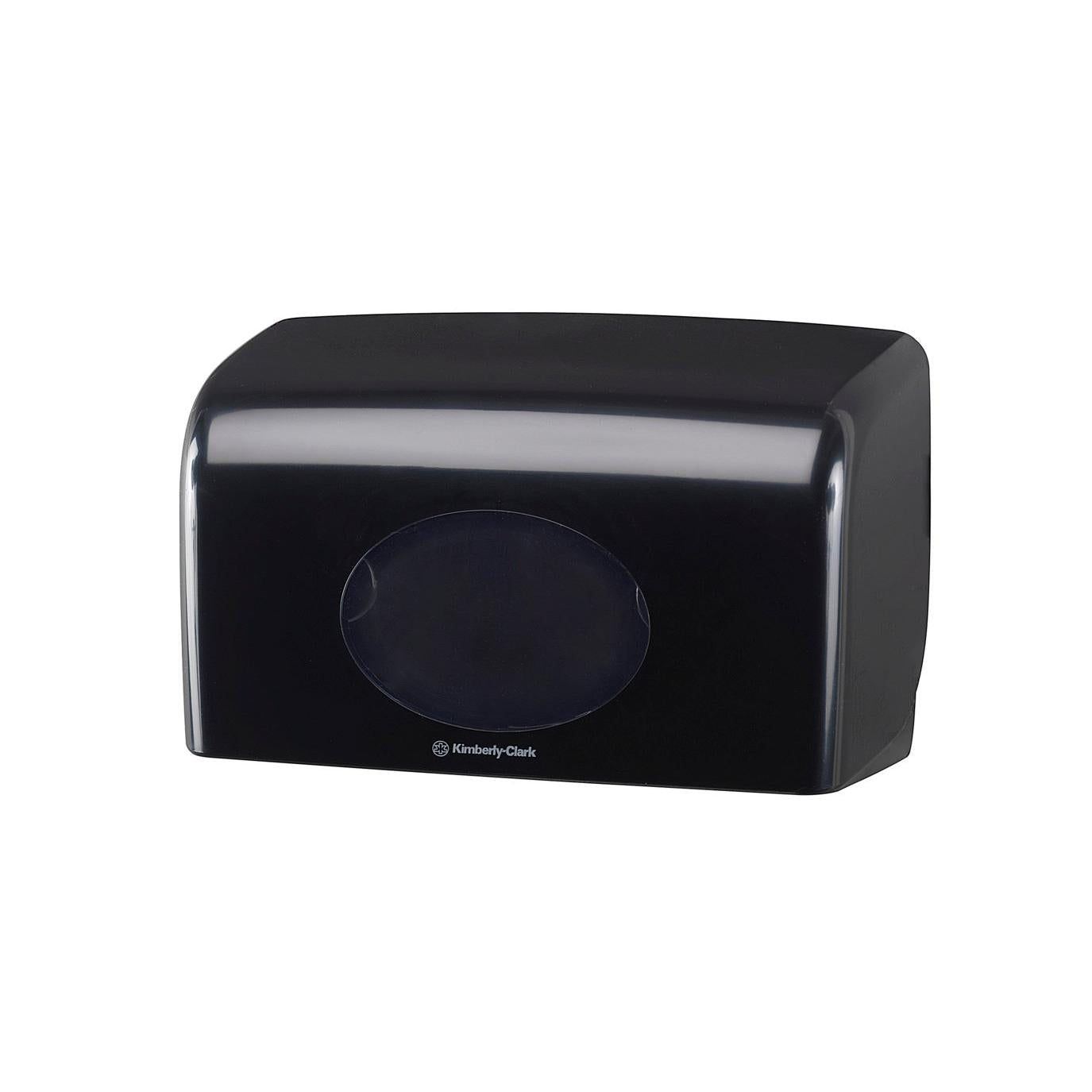 A black, rectangular Aquarius™ toilet paper dispenser from Kimberly-Clark GmbH (18.00 x 29.80 x 12.80 cm) with a transparent, oval window and the Kimberly-Clark logo below on a plain white background.