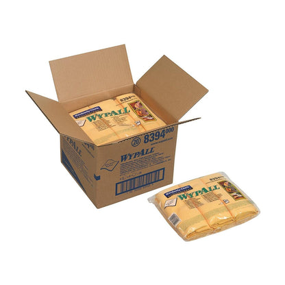An open box labeled "WypAll" contains several packs of WypAll® microfiber cloths - flat cloth (40 x 40 cm) from Kimberly-Clark GmbH. One pack is outside, clearly displaying its packaging and branding.