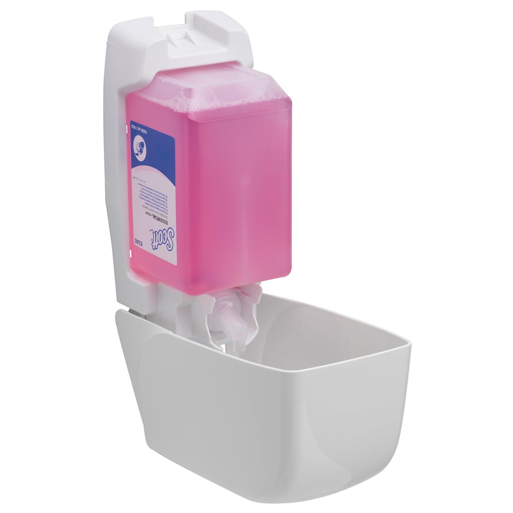 A wall-mounted Scott® Essential™ foam soap dispenser from Kimberly-Clark GmbH displays a large pink 1L cassette inside and a white drip tray below - ideal for daily hand cleaning.