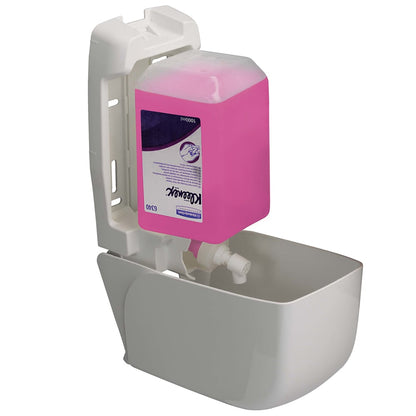 An open 1-liter white Aquarius™ lotion dispenser from Kimberly-Clark GmbH reveals a pink Kleenex soap refill; the housing and mechanism ensure hygienic hand washing in any environment.