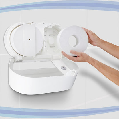 A person inserts a large roll of Scott® Control™ toilet paper - central dispensing from Kimberly-Clark GmbH into a white wall dispenser in a tiled toilet; the opened device releases the compartment and spindle - ideal for professional environments.