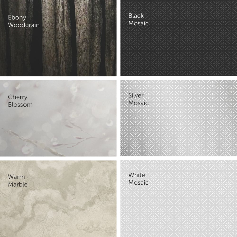 A grid of six pattern surfaces for the Kimberly-Clark Professional™ Icon™ toilet paper dispenser - small rolls from Kimberly-Clark GmbH: Ebony Woodgrain, Black Mosaic, Cherry Blossom, Silver Mosaic, Warm Marble, and White Mosaic - each in muted tones.