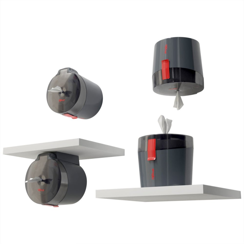 Four images show a dark gray WypAll® Reach Plus™ Centrefeed Dispenser from Kimberly-Clark GmbH with a red lever, mounted on or under white shelves. One dispenser is open and the towels are visible, the other is closed.