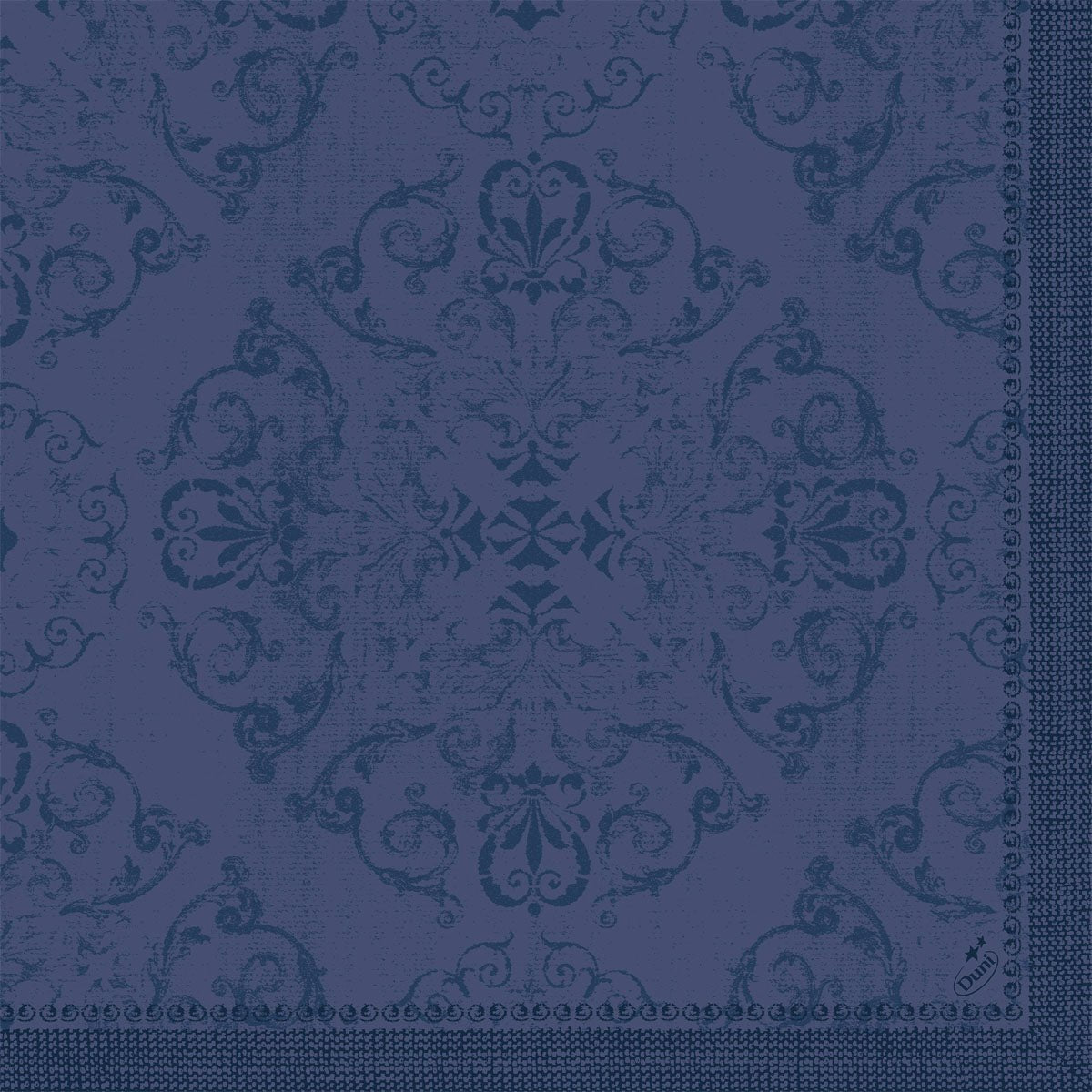 The Duni GmbH Dunilin napkins 40 x 40 cm 1/4 fold with dark blue, ornate damask pattern with floral and scroll motifs and a solid color border on two sides offer a structured, woven look for an elegantly set table.
