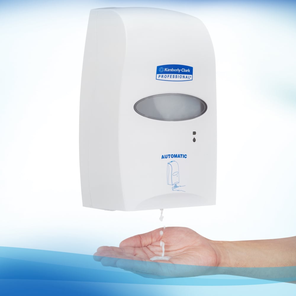 A wall-mounted dispenser labeled "Kimberly-Clark GmbH" dispenses Scott® CONTROL alcohol-based hand sanitizing foam (1.2L cartridge) for optimal hand hygiene. The transparent unit is depicted on a white background with blue accents.