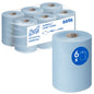 Six blue rolls of Scott® Essential™ Slimroll™ Hand Towels (190 m x 19.8 cm) from Kimberly-Clark GmbH, one roll at the front, packaging at the back with "6 x 190 m = 1,140 m", product code 6696 - environmentally friendly hand drying.