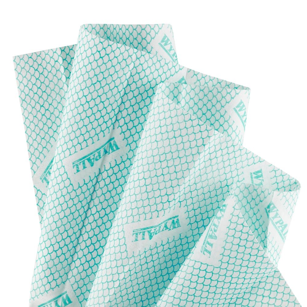 Several light blue WypAll® X80 Critical Clean - Interfold cloths from Kimberly-Clark GmbH, each with a repeating hexagonal pattern, are arranged overlapping on a white background.