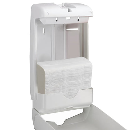 A white plastic wall dispenser is open and shows Scott® SLIMFOLD folded hand towels from Kimberly-Clark GmbH inside. The simple design offers hygienic hand drying with 16 clips x 110 sheets per carton (16 packs).