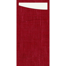 A rectangular piece of red, textured fabric by Duni GmbH, resembling the SACCHETTO Bio D-Soft, featuring a horizontal slit with a white, rectangular card partially inserted into a slanted upper opening.