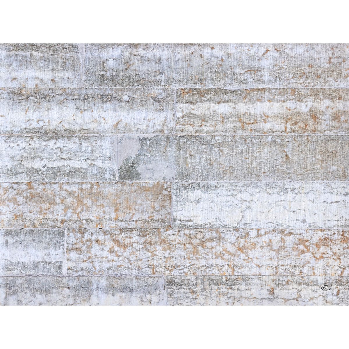 A close-up of the Duni GmbH paper placemats 30x40 cm in Stone: stylish, weathered placemats in white, gray, and brown tones with visible, mortar-inspired patterns - perfect for sophisticated table decoration. Pack of 250 pieces.