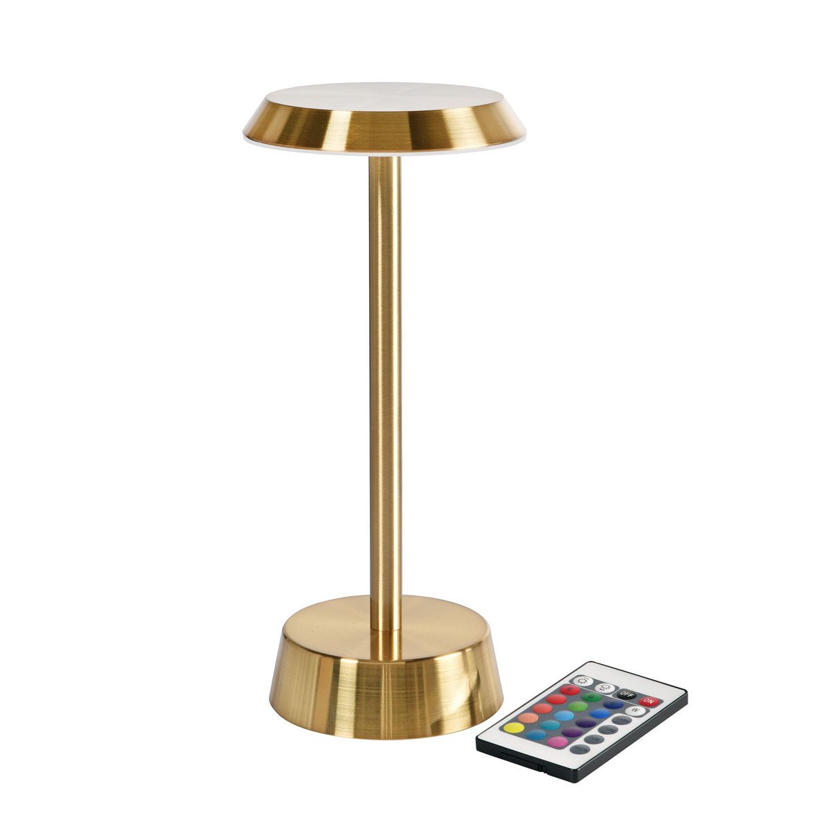 The wireless LED lamp NOUR in brass by Duni GmbH with a modern design and round base stylishly complements the elegant brass vase and the colorful remote control button on the table.
