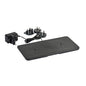The Duni GmbH LED charging station, dual for two lamps, is a black rectangular device with a power cable, adapter, and 3 plug attachments - ideal for efficiently charging two LED lamps. Pictured on a white background. Packaging (1 piece).