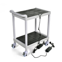 A white, two-story LED charging station trolley for lamps by Duni GmbH with black mats, four wheels, and two black power supplies is placed on the floor - a practical storage solution for 24 lamps (carton, 1 piece).