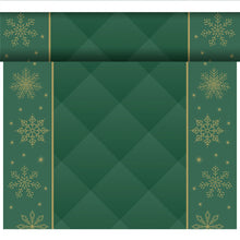 A roll of green organic Dunicel-Tete a Tete 0.4x24m from Duni GmbH with golden snowflakes and stars on the sides and a green diamond in the center, ideal for sustainable table decoration or in combination with an organic Dunicel tablecloth. Partially unrolled.