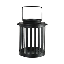 The Duni GmbH glass candle holder, 16.5x20 cm (Fyr) is a simple black metal lantern with vertical bars, a top handle, and a glass candle holder - perfect as an elegant single-piece table decoration.