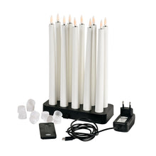 A pack of 1 Duni GmbH LED taper candles 27.8 cm in warm white is elegantly presented with a black charging station, remote control, plug adapter, USB cable, and white caps - perfect for stylish home decoration.