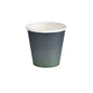 A single Duni GmbH paper cup WBC Urban, 180ml (pack: 40 pieces), with a white interior and a black to green gradient exterior, is seen against a white background.