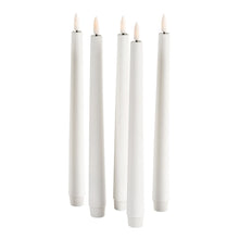 The LED replacement set of taper candles from Duni GmbH is a high-quality decorative candle with a pointed tip, plastic flame, and twist-off base. The battery-operated white taper candle stands upright and is perfect for stylish home decoration. Package: 1 piece.