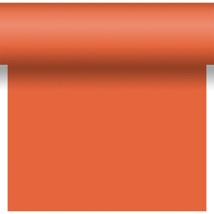 A roll of Bio-DC-Tete a Tete 0.4x24m by Duni GmbH in orange, partially unrolled downward on a white background with a shadow near the wavy top edge.