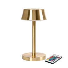 The LED lamp Nour Midi from Duni GmbH impresses with a brass-colored, modern design as well as a cylindrical base and round shade. A remote control ensures energy-efficient lighting. The package contains 1 piece.