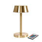 The LED lamp Nour Midi from Duni GmbH impresses with a brass-colored, modern design as well as a cylindrical base and round shade. A remote control ensures energy-efficient lighting. The package contains 1 piece.