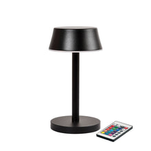The Nour Midi LED lamp in graphite by Duni GmbH features a modern cylindrical base and a flat round shade. It comes with a remote control and impresses with innovative features and a stylish design - perfect for modern table lighting.