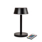 The Nour Midi LED lamp in graphite by Duni GmbH features a modern cylindrical base and a flat round shade. It comes with a remote control and impresses with innovative features and a stylish design - perfect for modern table lighting.
