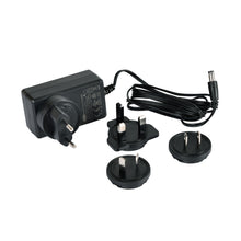 A black power adapter from Duni GmbH with a detachable cable and four plug attachments, compatible as a replacement adapter for LED charging station 206437 - High-quality adapter (1 piece), shown on a white background.