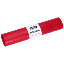 A roll of EMIL DEISS KG (GmbH + Co.) DEISS 21070 garbage bags, 700x1100 mm type 60 red, roll with 25 pieces and white label with "DEISS garbage bags" and recycling info, lies on white background.