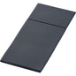 A dark gray, rectangular, triple-folded mattress or cushion is neatly folded, with a visible crease separating the sections. The subtly textured fabric resembles the hygienic bases used in Duniletto-Slim 40x33cm by Duni GmbH.