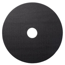 A flat, black, round object with a textured surface and central hole, resembling the Twister Hybrid Holder (holder for the Twister Hybrid Tool) by Diversey Deutschland GmbH & Co. OHG and similar in design to a floor polishing pad, on a white background.