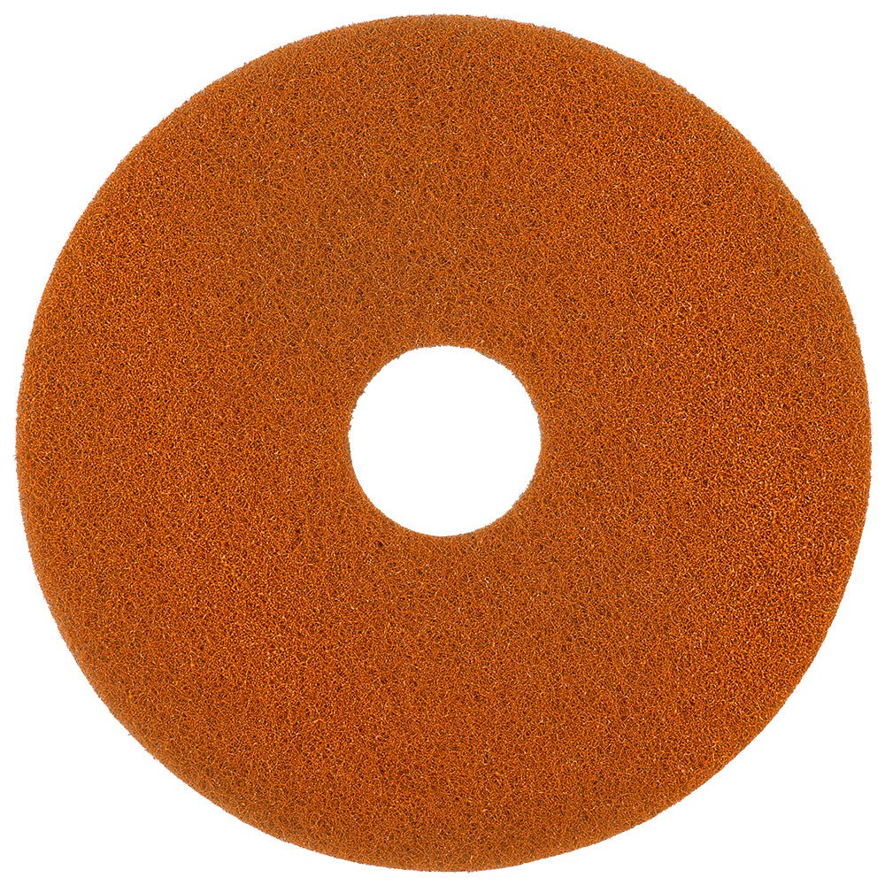 The Twister Pad orange for stone floors by Diversey Deutschland GmbH & Co. OHG is a round, orange, textured pad with a hole in the center, designed for floor cleaning with microscopic diamonds – ideal for use with polishing machines or polishers.