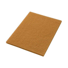A rectangular brown cork board is seen at an angle on a white background – perfect for demonstrating the use of Twister HT Restoration Pads orange for stone floors, heavily frequented by Diversey Deutschland GmbH & Co. OHG.