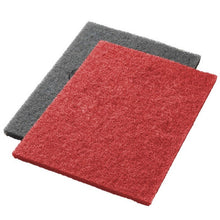Pictured are two Twister Pads from Diversey Deutschland GmbH & Co. OHG: a red scrubbing and deep cleaning pad and a gray pad. Both have a rough, textured surface for effective deep cleaning.