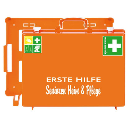 The orange First Aid Senior Home and Care MT-CD from W. Söhngen GmbH is a first aid kit with green crosses, white lettering "FIRST AID Senior Home & Care" and Aluderm® bandages for safety in the senior and care home. Package (1 piece).