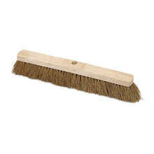 The Nölle Profi Brush hall broom natural coconut saddle wood by Nölle Profi Brush brush & paintbrush technology e.K. with densely filled coconut bristles and central handle hole is depicted on a white background.