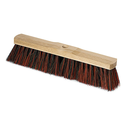 The Nölle Profi Brush hall broom Arenga/Elaston saddle wood with handle hole broom head from Nölle Profi Brush Bürsten- & Pinseltechnik e.K. is equipped with dense black-red bristles and stands on a white base.