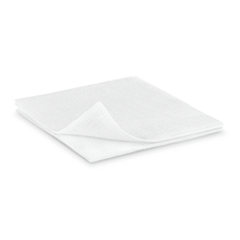 A white, folded Hartmann ES compress (non-sterile) by Paul Hartmann AG lies on a plain white background, with one corner lifted showing the soft, textured surface - ideal for gentle wound care.