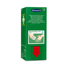 The green box (40 pieces) from Orkla Wound Care AB Salvequick savett wound cleaner (0.9% NaCl, sterile) is marked with a white cross, multilingual text, an illustration for cleaning hands, and a large red arrow pointing downwards on the lower part.