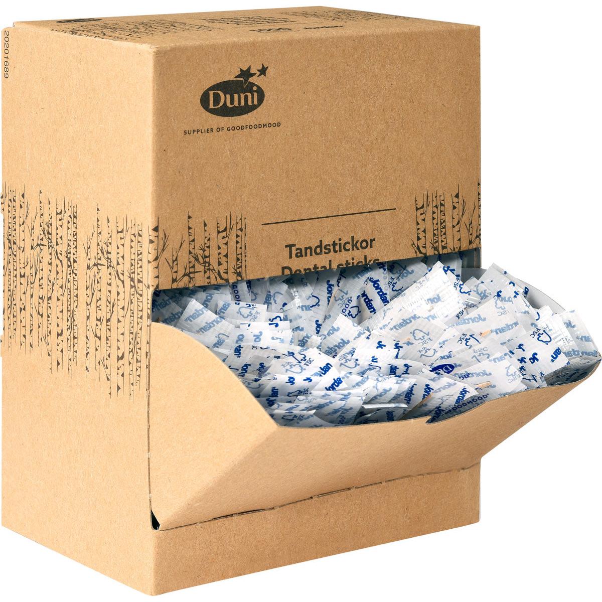 A brown cardboard donation box with the inscription "Duni GmbH Toothpick Neutral Wood 50 | Pack (1000 pieces)" contains individually wrapped wooden toothpicks in white and blue packaging, some of which are visible through the open front flap.