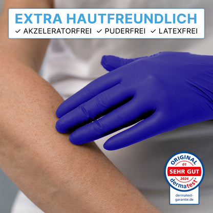A person is wearing ARNOMED NITRIL XTRA PURE disposable gloves from ARNOWA GmbH and touching an arm - the image emphasizes the dermatest-tested skin compatibility of the latex- and powder-free, accelerator-free nitrile gloves.