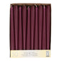 A cardboard box with 50 chestnut-brown, 25 cm long and 2.2 cm thick taper candles, arranged in a single row when viewed from above. The label reads "Starpak 50 Taper Candles Ø 2.2 cm-25 cm" with quantity information in several languages.